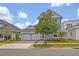 Charming two-story home with manicured landscaping and a spacious three-car garage at 14559 Walcott Ave, Orlando, FL 32827