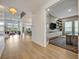 Grand foyer leading into an open-concept living space, complete with hardwood flooring at 14559 Walcott Ave, Orlando, FL 32827