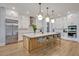 Bright kitchen with a large island, stainless steel appliances, and ample cabinetry at 14559 Walcott Ave, Orlando, FL 32827