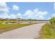 Scenic water view with a walking path in a residential neighborhood on a sunny day at 14559 Walcott Ave, Orlando, FL 32827