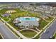 Aerial view of a community center with pool, playground, and recreational area at 15210 Chapter Way, Winter Garden, FL 34787