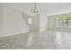 Spacious living area with tile floors, ample natural light, and an open layout at 15210 Chapter Way, Winter Garden, FL 34787