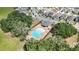 Aerial view of the community pool, clubhouse and surrounding neighborhood at 1539 Wynell St, St Cloud, FL 34771