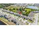 High-angle view of residential area with multiple homes and a serene pond at 1539 Wynell St, St Cloud, FL 34771
