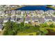 Elevated angle of residential neighborhood featuring a pond, houses, and manicured lawns at 1539 Wynell St, St Cloud, FL 34771