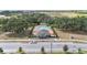 Aerial view of community pool and amenities with parking, surrounded by trees and landscaping at 1539 Wynell St, St Cloud, FL 34771