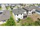 Aerial view of the backyard, featuring a screen porch and green grass at 1539 Wynell St, St Cloud, FL 34771
