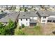 Aerial view of backyard with screen enclosed patio, AC units, and lawn space at 1539 Wynell St, St Cloud, FL 34771