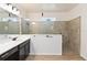 Bathroom with spacious shower featuring tile surround and white quartz countertop on vanity at 1539 Wynell St, St Cloud, FL 34771
