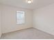 Empty bedroom featuring neutral carpet, white walls and window with blinds at 1539 Wynell St, St Cloud, FL 34771