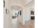 Welcoming entryway with elegant tile flooring, arched doorway, and an open view to the living area at 1539 Wynell St, St Cloud, FL 34771