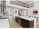Modern kitchen features stainless appliances, an island with seating, and easy access to the living and dining areas at 1539 Wynell St, St Cloud, FL 34771