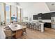 Open-concept living space with soaring ceilings, abundant natural light, and modern kitchen at 1539 Wynell St, St Cloud, FL 34771