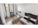 Open-concept living room and kitchen area with high ceilings and ample natural light at 1539 Wynell St, St Cloud, FL 34771