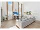 Bright living room with soaring ceilings, large windows, and a comfortable sofa at 1539 Wynell St, St Cloud, FL 34771