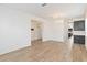 Open living area featuring wood-look floors, and chandelier in a well-lit space at 1539 Wynell St, St Cloud, FL 34771