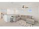 Upstairs living area featuring a spacious gray sectional sofa and abundant natural light at 1539 Wynell St, St Cloud, FL 34771