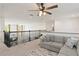 Upstairs living room showcasing neutral carpet and a comfortable gray sofa, perfect for relaxation at 1539 Wynell St, St Cloud, FL 34771