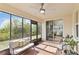 Enclosed patio featuring brick flooring, ceiling fan, and comfortable seating at 1539 Wynell St, St Cloud, FL 34771