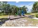View of the community playground with slides and climbing structures at 1539 Wynell St, St Cloud, FL 34771