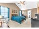 This bedroom features a bed, desk, and large walk-in closet at 16078 St Clair St, Clermont, FL 34714