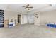 Spacious bonus room with chairs, carpet, and a staircase at 16078 St Clair St, Clermont, FL 34714