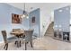 Cozy dining area with modern chairs, table, and staircase in the background at 16078 St Clair St, Clermont, FL 34714