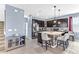 Modern kitchen with an island, bar seating, stainless steel appliances, and dark cabinetry at 16078 St Clair St, Clermont, FL 34714