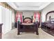 This is a cozy main bedroom with a dark wood bed frame and neutral colored walls at 16078 St Clair St, Clermont, FL 34714