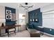 Versatile bedroom or office space with stylish decor, ample natural light, and unique guitar accents at 16354 Grey Pine Dr, Winter Garden, FL 34787