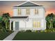 Charming two-story home showcasing a welcoming front porch and attractive architectural details at 16354 Grey Pine Dr, Winter Garden, FL 34787