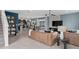 Open-concept living area with modern decor seamlessly connects to the kitchen and dining at 16354 Grey Pine Dr, Winter Garden, FL 34787