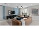 Stylish living room features modern lighting, designer furniture, and large windows at 16354 Grey Pine Dr, Winter Garden, FL 34787