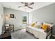 Bedroom with neutral walls featuring carpeted floors, sun-filled window and daybed at 1986 Yellowfin Dr, Port Orange, FL 32128