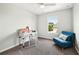Bedroom with neutral walls featuring carpeted floors, a desk, a chair and natural light from window at 1986 Yellowfin Dr, Port Orange, FL 32128