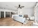 Open-concept living room with wood-look tile flooring connecting to the kitchen and dining spaces at 1986 Yellowfin Dr, Port Orange, FL 32128