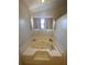 This bathroom features a large, jacuzzi-style bathtub with a window at 2236 Dancy Trail Trl, Clermont, FL 34714