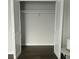 Open closet with white bi-fold doors, shelf and bar for organized storage at 2236 Dancy Trail Trl, Clermont, FL 34714