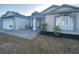 Inviting home exterior with a two-car garage, lush landscaping, and a charming front entrance at 2236 Dancy Trail Trl, Clermont, FL 34714