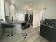 Open kitchen featuring gray cabinets, granite countertops, and stainless-steel appliances at 2236 Dancy Trail Trl, Clermont, FL 34714