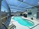 Screened-in pool and patio area perfect for outdoor relaxation and entertaining at 2236 Dancy Trail Trl, Clermont, FL 34714