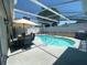 Inviting in-ground screened pool and patio area for outdoor enjoyment and leisure at 2236 Dancy Trail Trl, Clermont, FL 34714