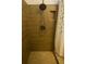 This shower features horizontal tile, bronze hardware, and a built-in toiletry shelf at 2236 Dancy Trail Trl, Clermont, FL 34714
