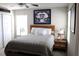 Inviting bedroom with natural light, complemented by cozy decor and a stylish bed at 2415 Sweet Viburnum Way, Ocoee, FL 34761