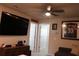 Large television and couch in this bonus room, perfect for relaxation and recreation at 2415 Sweet Viburnum Way, Ocoee, FL 34761