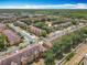 Aerial community view highlighting the homes and surrounding greenery of a well-established neighborhood at 2744 Calabria Ave, Davenport, FL 33897