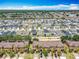 Community aerial view showcasing numerous homes and green spaces in a well-planned neighborhood at 2744 Calabria Ave, Davenport, FL 33897
