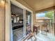 Cozy balcony offering great views from sliding glass doors to the main bedroom at 2744 Calabria Ave, Davenport, FL 33897