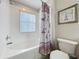 Bathroom featuring a bathtub, toilet, and a decorative shower curtain at 2744 Calabria Ave, Davenport, FL 33897