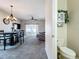 Bathroom showing a toilet and a cabinet with decorative plants at 2744 Calabria Ave, Davenport, FL 33897